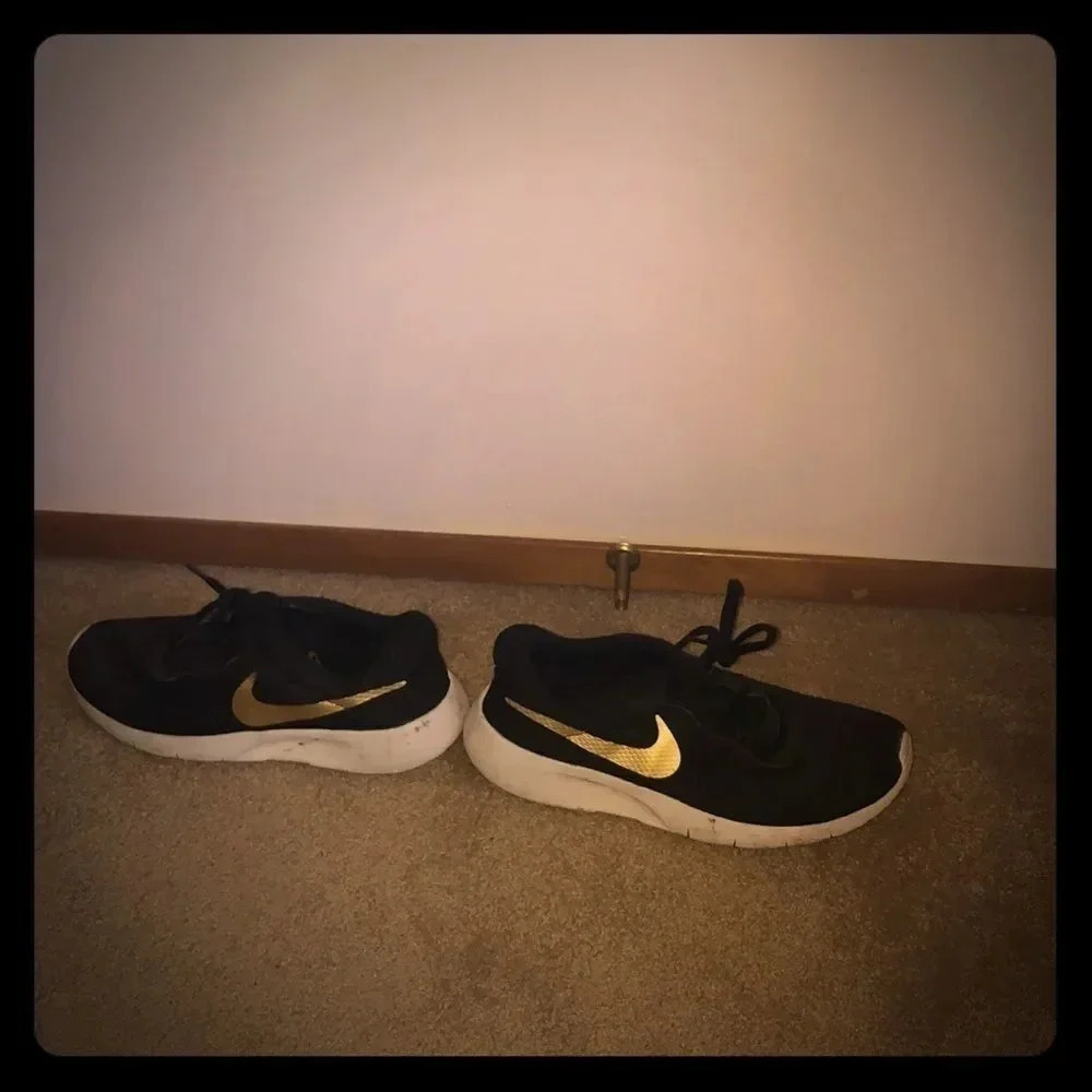 Nike’s with a gold swoosh